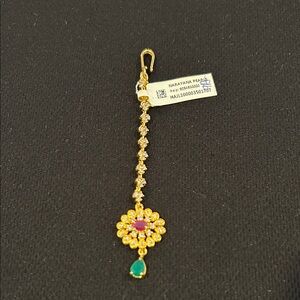 Indian Hair Accessory: worn on the hair, coming down the center of the forehead